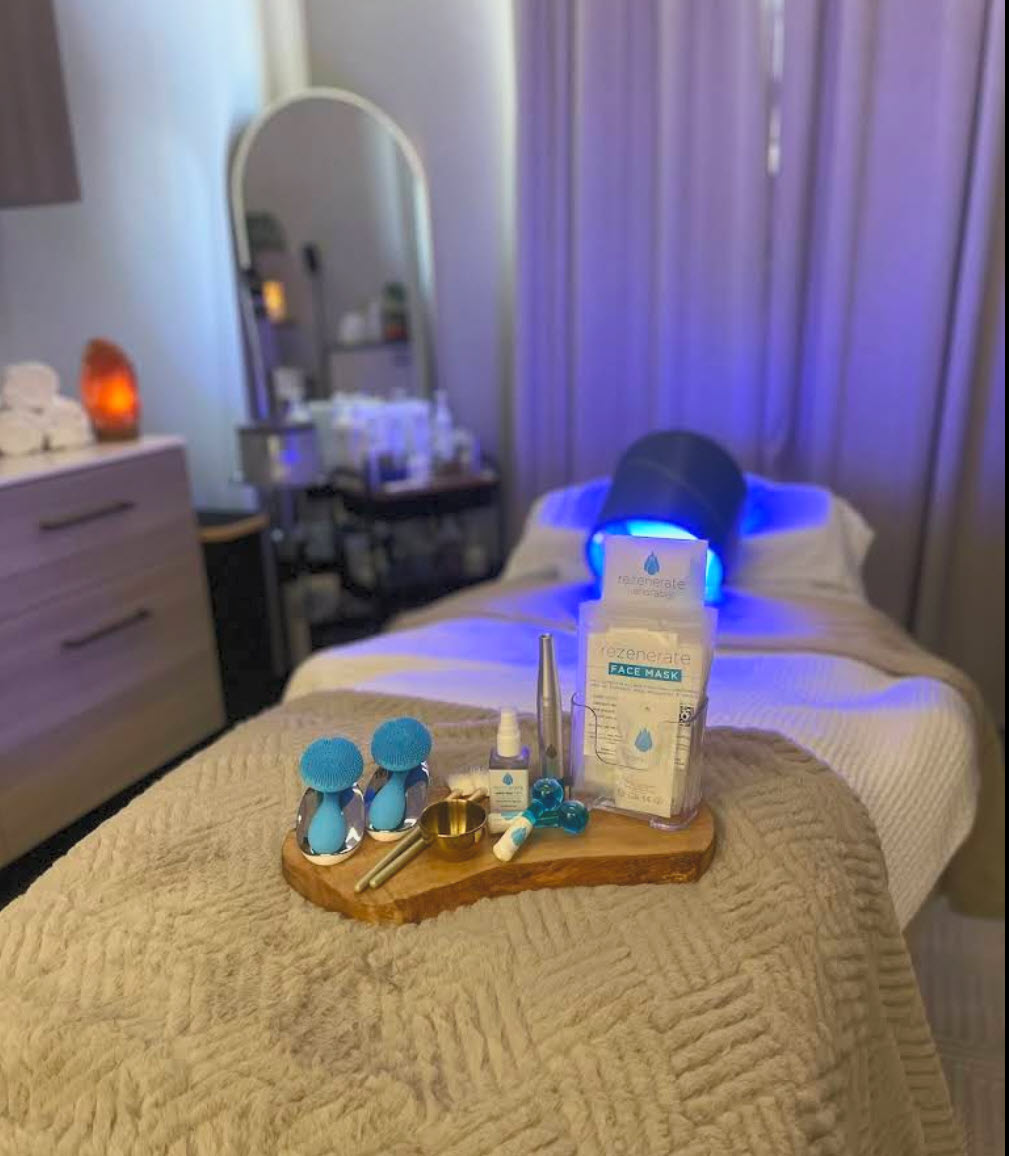 Treatment bed with LED therapy mask and crystal skincare tools